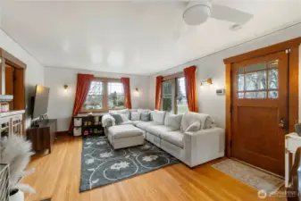Hardwood in home with original windows and doors.