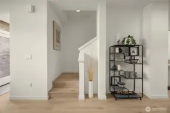 Modern elegance defined by two-tone cabinetry and designer tile work that elevates everyday routines