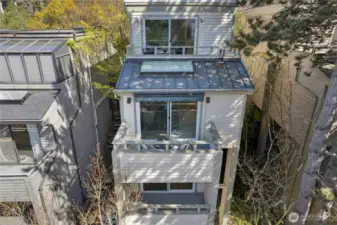 Cedar sided. Metal roof and flat roof recently replaced