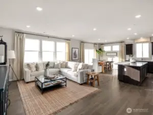 Another great view of the great room.  Wow, check out all the windows. Photos are representational. Actual colors and finishes will vary. See site agent for details.