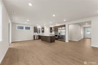 Great photo showcasing large open concept great room. Actual home is under construction and materials, colors, and finishes will vary. See site agent for details.