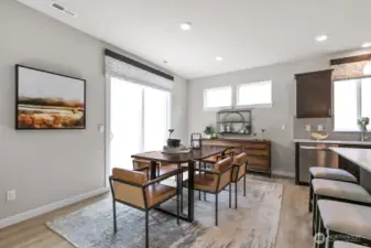 Huge center island to accommodate 4 bar stools next to dining area.  Photos are representational. Actual colors and finishes will vary. See site agent for details.