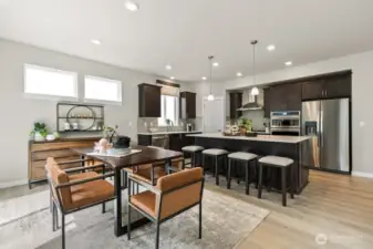 Huge center island to accommodate 4 bar stools.  Photos are representational. Actual colors and finishes will vary. See site agent for details.