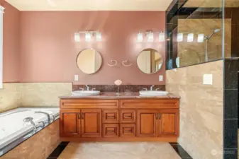 Sumptuous primary baths- is a room with a view… two sinks, walk in shower and a soaking tub.