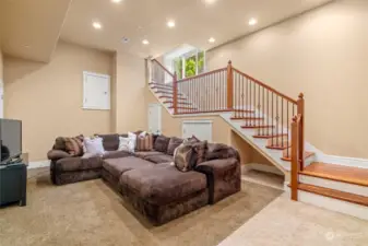 The lower level features the home theater/family room-which offers great storage and a comfy place to visit with your guests for the big ballgames. Behind the couch and under the stairs is wine storage and room for all the toys!