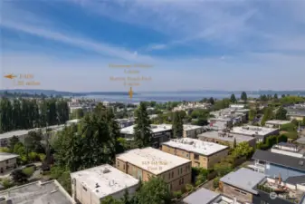 A bird's eye view looking southwest to Lake Washington, Seattle skyline in the distance. I-405 is to the East, just up the hill. Lots of beaches to meander along Lake Washington Boulevard...restaurants, coffee, shops- your heart's delight! Welcome home.