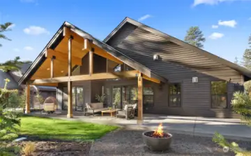 Covered back patio with gas firepit.