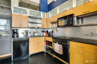 Well thought out with plenty of cabinetry, open shelving, and pull-out drawers perfect for pots and pans, this kitchen is mighty in space and ease for meal preparation!