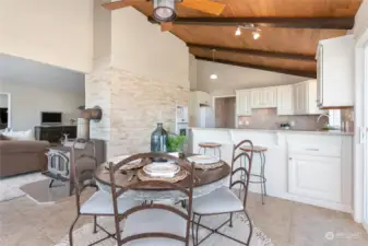 A view of the kitchen, dining and living areas