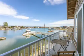 View from the balcony outside the upstairs bedroom. Imagine having your morning coffee overlooking the water and mountains!