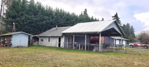 View of carport, garden shed and shop