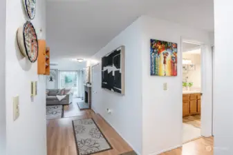 Inside entry to condo. You have coat closet directly to your right and kitchen to your left.