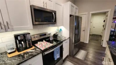 The utility room and garage entrance are conveniently just off the kitchen.