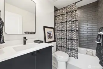 Second bathroom with designer tile finishes.