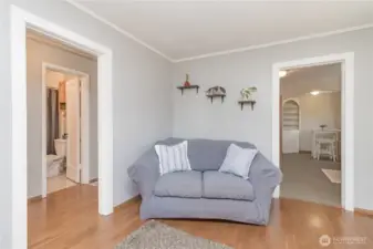 Such a warm and cozy feeling, entrance to bedrooms and kitchen right off the living room!