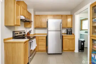 With a spacious layout, beautiful tile flooring, and room to move around, this kitchen offers functionality and style.