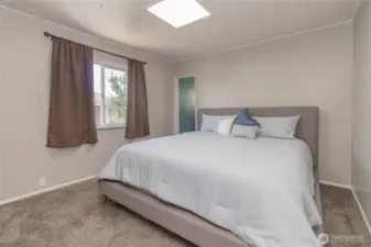 Primary bedroom with king size bed for size comparison
