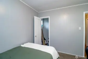 Complete with a closet and soft carpet underfoot, this secondary bedroom offers comfort and functionality in one sweet space.