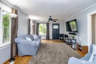 Step into a living room that feels instantly welcoming — with windows on both sides, natural light pours in all day long. There's plenty of room to stretch out, entertain, or cozy up for movie night!