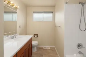 Updated bathroom in the hallway includes a bathtub.