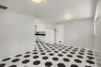 Kitchen connects to garage and laundry area.