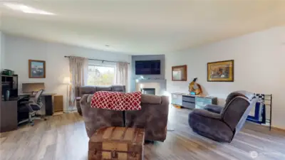 Bright and inviting family room with luxury vinyl plank flooring through most of the home.