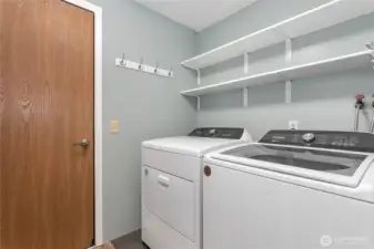 Laundry which is in the utility room and said entry. This room has brand new LVP flooring.