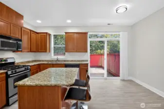 Kitchen leads to back patio/yard space