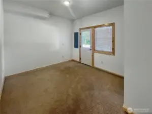 Lower level bedroom two,  with access to the back yard.