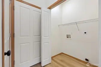 Laundry room.  Entry door to Garage and entry to lower level