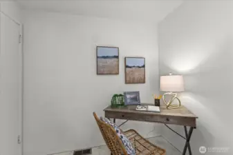 This space is off of the kitchen and is perfect for an at home office or small dining nook!