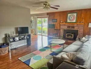 Living room with fireplace insert. *Current photos unavailable due to tenancy restrictions.