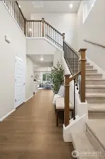 A spacious, light-filled entry creates a warm and inviting first impression. With soaring ceilings and an open sightline into the heart of the home, this welcoming foyer sets the tone for the elegance and comfort found throughout.