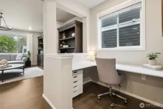 A dedicated nook just off the main living area offers the perfect work-from-home or homework station. Thoughtfully positioned to stay connected to the heart of the home, it provides functionality and flexibility without sacrificing the open, airy feel of the space.