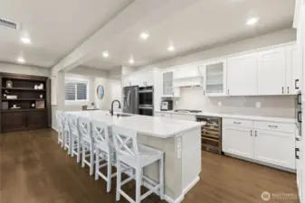 Abundant cabinetry and generous counter space make this kitchen as functional as it is beautiful. Whether prepping weeknight meals or holiday feasts, you’ll have room for it all The built-in beverage/wine fridge stays with the home.