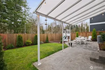 The extended outdoor living space creates room to relax, dine, and play. It’s an ideal backdrop for making memories.