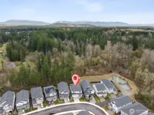 Backing to community green space adds both beauty and tranquility. It’s a setting that offers rare privacy within the neighborhood.