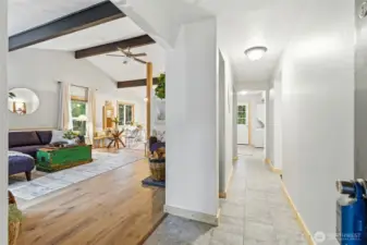Entry hallway to living room and door to patio.