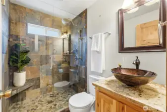 Beautifully tiled full size shower.