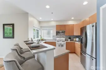 Designed for everyday convenience, the kitchen features abundant cabinetry and expansive countertops - ideal for meal prep and storage alike.