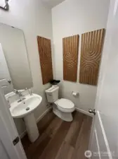 Mian floor powder room of model home. Finishes and features may vary.