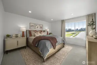 Primary bedroom of model home. Finishes and features may vary.