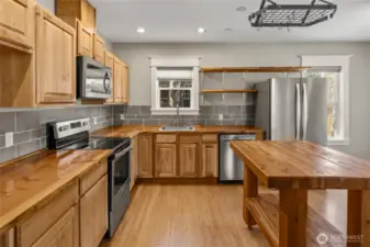 The wood countertops are a special touch. Don't miss the new stainless sink.