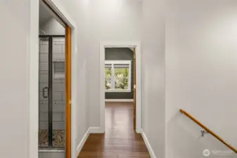 Upstairs bedroom- looks back into the woods for privacy! There is a huge closet in here plus a bonus finished area/attic space for storage or playroom!