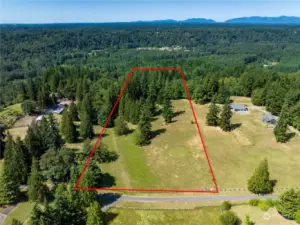 Looking north - front half of property is pasture and lightly treed. Back half slopes down into forested area. Approximate property lines shown.