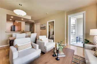 Another view of the living area leads to your private covered deck to enjoy the Space Needle views.