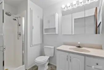 The spotless 3/4 bath also has brand new flooring.