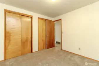 Primarily bedroom with two large closets.