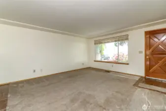 Front door and large window for lots of natural light.