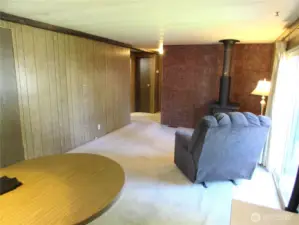 KITCHEN OPENS TO FAMILY ROOM, HALLWAY AND SLIDING GLASS DOOR TO RIGHT.